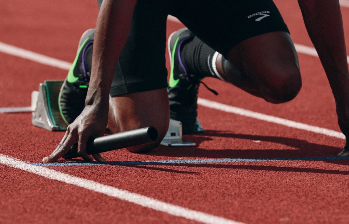 man on running field